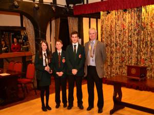 President Chris Bushell and the winning team from William de Ferrers School holding the cup 